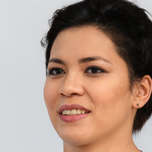 Joyful asian young-adult female with long  black hair and brown eyes