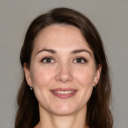 Joyful white young-adult female with medium  brown hair and brown eyes