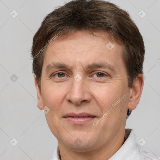 Joyful white adult male with short  brown hair and brown eyes