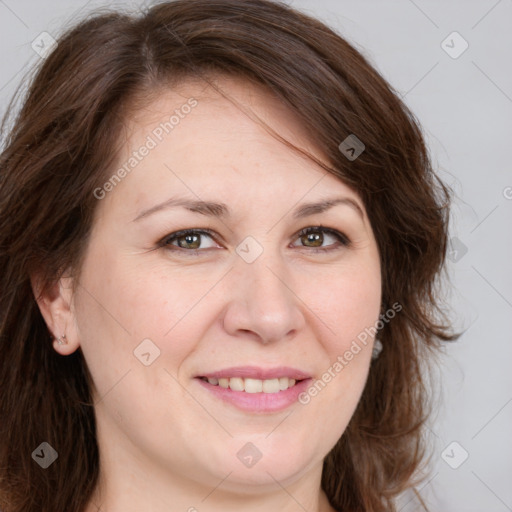 Joyful white adult female with long  brown hair and brown eyes