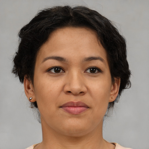 Joyful asian adult female with medium  brown hair and brown eyes