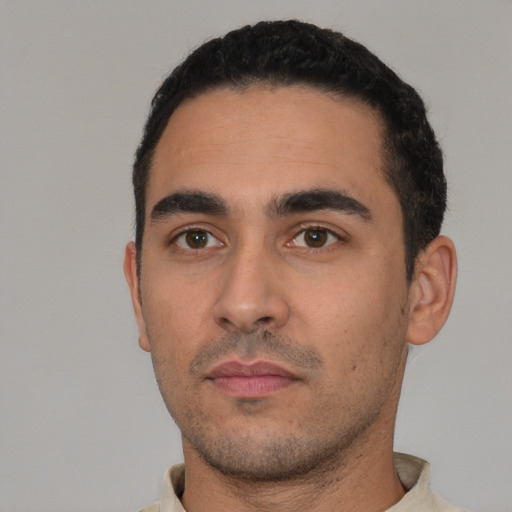 Neutral white young-adult male with short  black hair and brown eyes