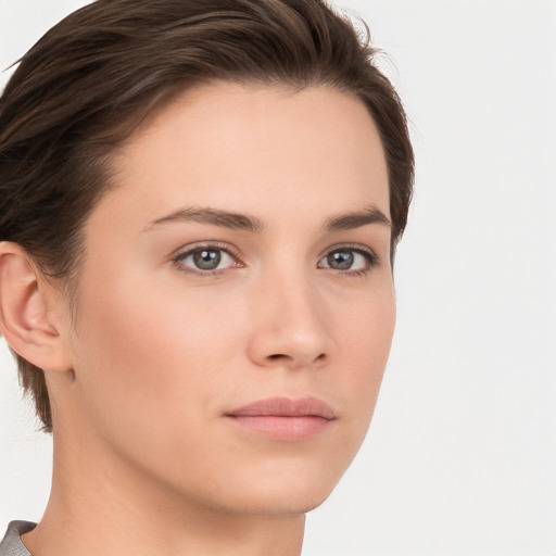 Neutral white young-adult female with short  brown hair and brown eyes