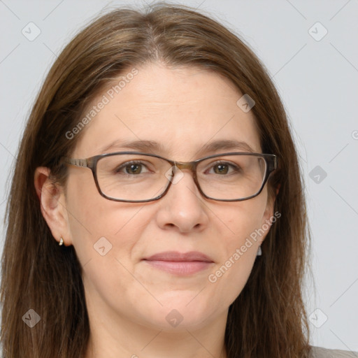 Joyful white adult female with long  brown hair and grey eyes