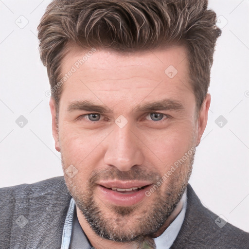 Joyful white adult male with short  brown hair and grey eyes