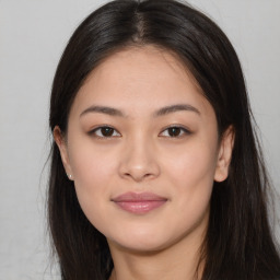 Joyful asian young-adult female with long  brown hair and brown eyes