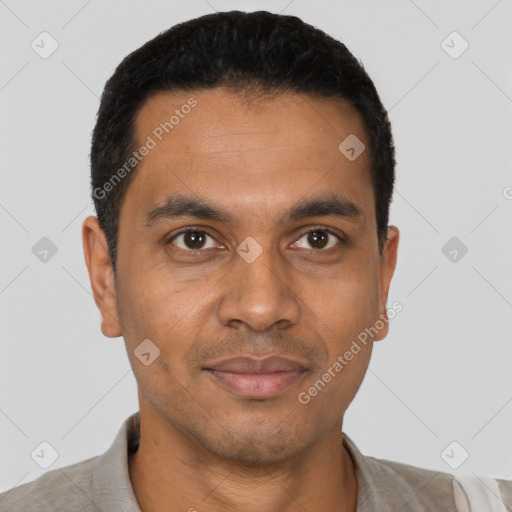 Joyful latino young-adult male with short  black hair and brown eyes