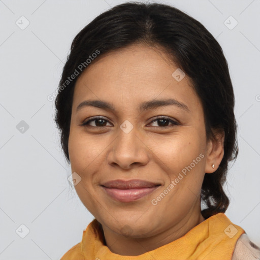 Joyful latino young-adult female with long  brown hair and brown eyes