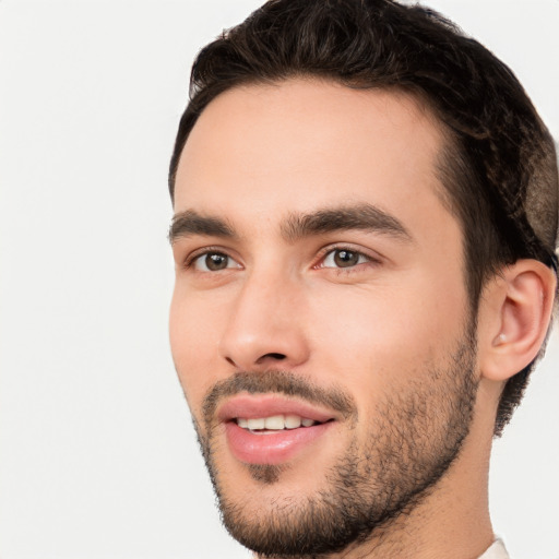 Joyful white young-adult male with short  black hair and brown eyes