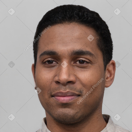 Joyful latino young-adult male with short  black hair and brown eyes