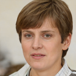 Joyful white adult female with medium  brown hair and brown eyes