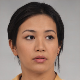 Neutral asian young-adult female with medium  black hair and brown eyes