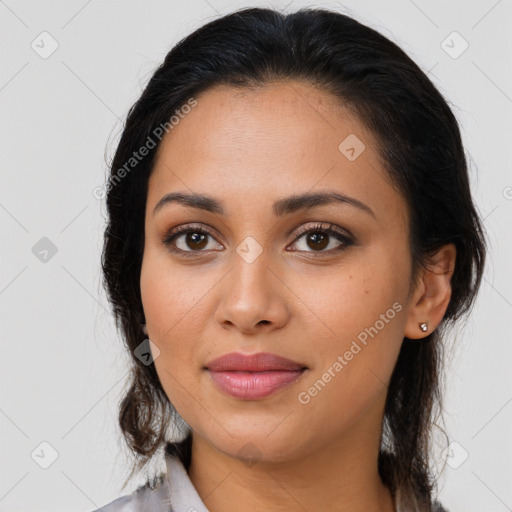 Joyful latino young-adult female with medium  brown hair and brown eyes