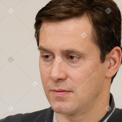 Neutral white adult male with short  brown hair and brown eyes