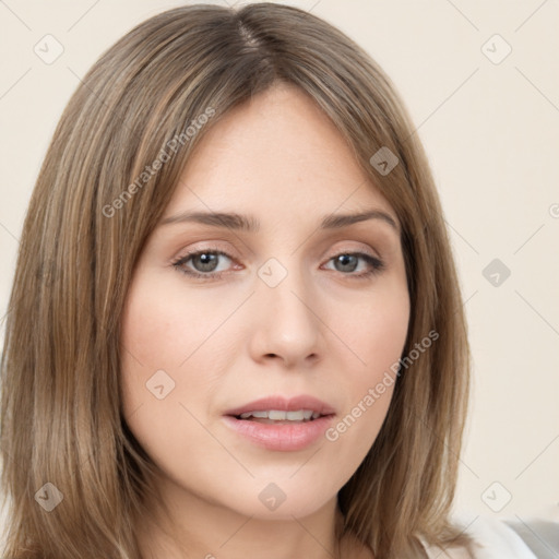 Neutral white young-adult female with long  brown hair and brown eyes