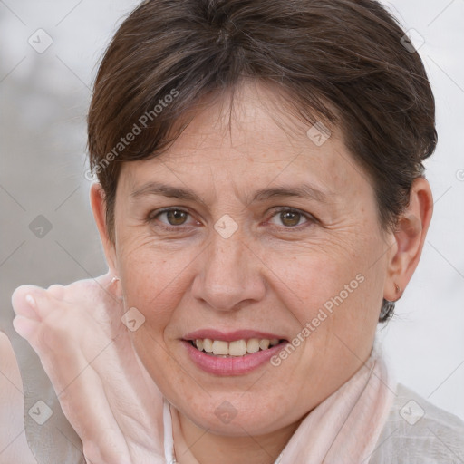 Joyful white adult female with short  brown hair and brown eyes