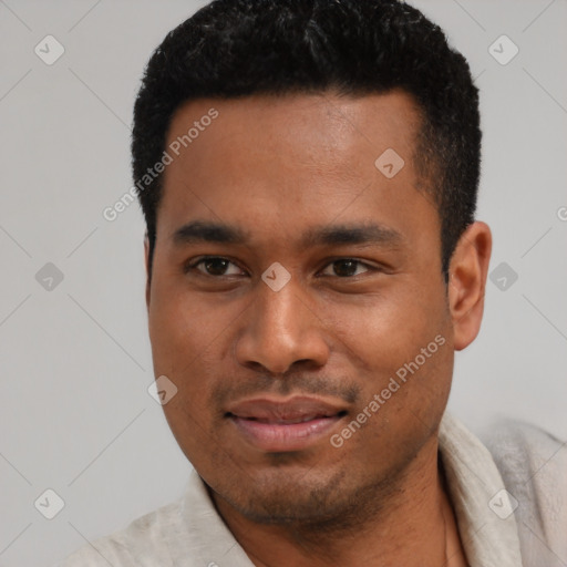 Joyful latino young-adult male with short  black hair and brown eyes