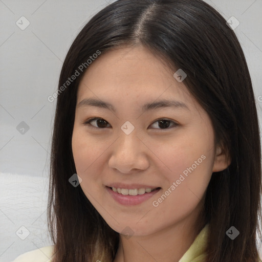 Joyful asian young-adult female with long  brown hair and brown eyes