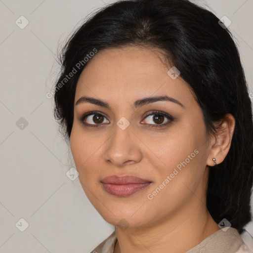 Joyful latino young-adult female with medium  brown hair and brown eyes