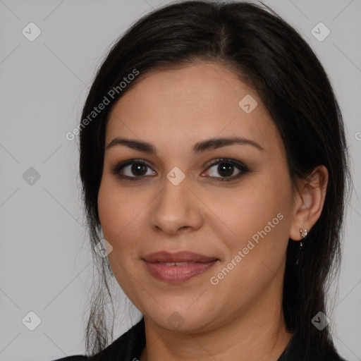 Joyful latino young-adult female with long  brown hair and brown eyes