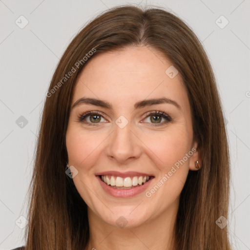 Joyful white young-adult female with long  brown hair and green eyes