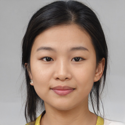 Joyful asian young-adult female with medium  brown hair and brown eyes