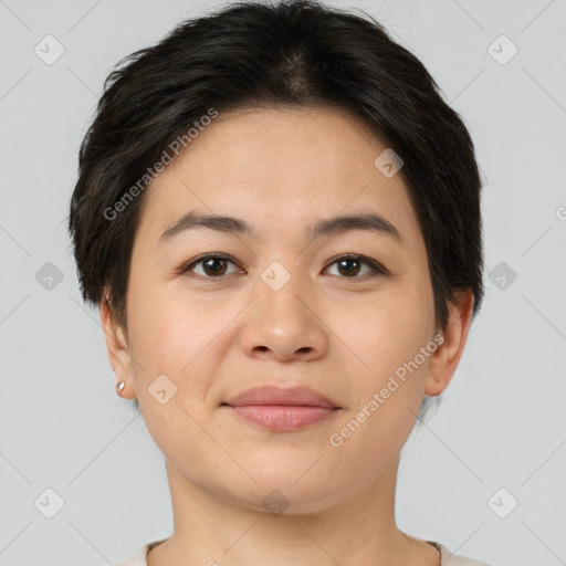 Joyful asian young-adult female with short  brown hair and brown eyes