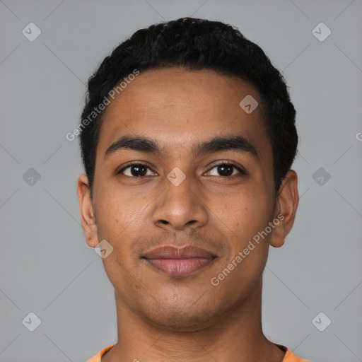 Joyful latino young-adult male with short  black hair and brown eyes