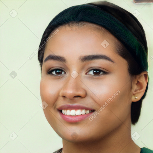 Joyful latino young-adult female with long  black hair and brown eyes