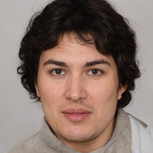 Joyful white young-adult male with medium  brown hair and brown eyes