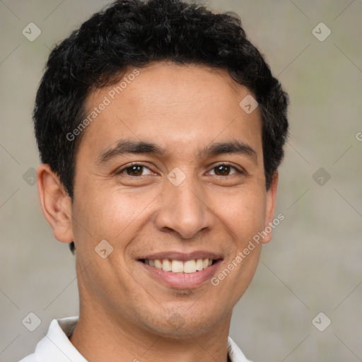 Joyful latino young-adult male with short  brown hair and brown eyes