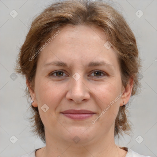 Joyful white adult female with medium  brown hair and brown eyes