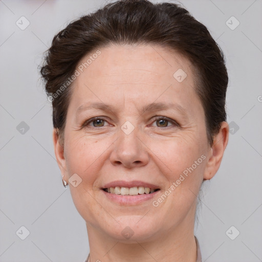 Joyful white adult female with short  brown hair and brown eyes