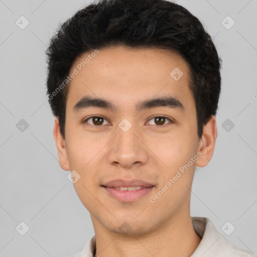 Joyful latino young-adult male with short  black hair and brown eyes