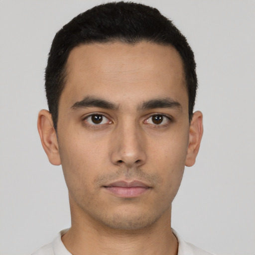 Neutral latino young-adult male with short  black hair and brown eyes