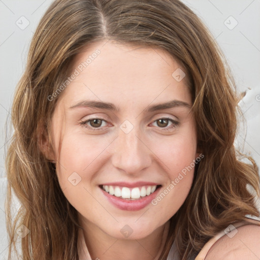 Joyful white young-adult female with long  brown hair and green eyes