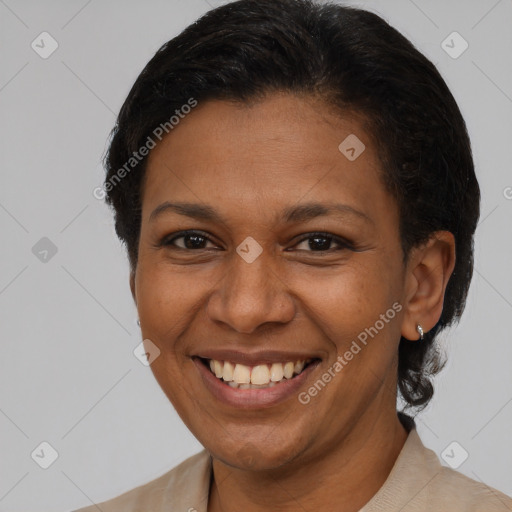 Joyful latino adult female with short  brown hair and brown eyes