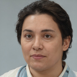 Joyful white adult female with short  brown hair and brown eyes