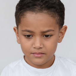 Joyful white child female with short  brown hair and brown eyes