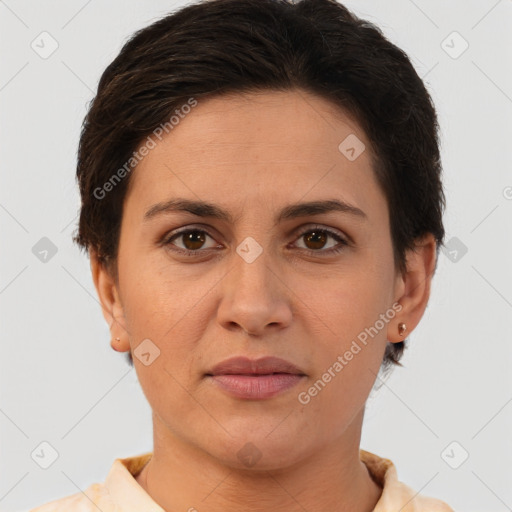 Joyful white adult female with short  brown hair and brown eyes