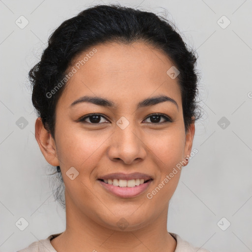 Joyful latino young-adult female with short  brown hair and brown eyes