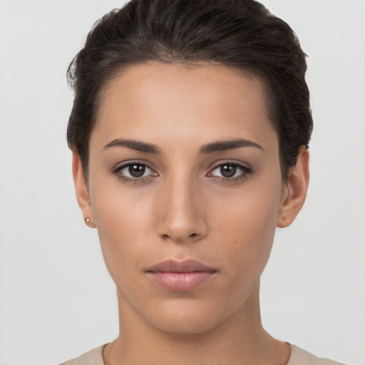 Neutral white young-adult female with short  brown hair and brown eyes