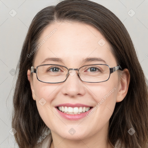 Joyful white young-adult female with long  brown hair and grey eyes