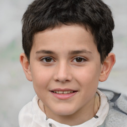 Joyful white child male with short  brown hair and brown eyes