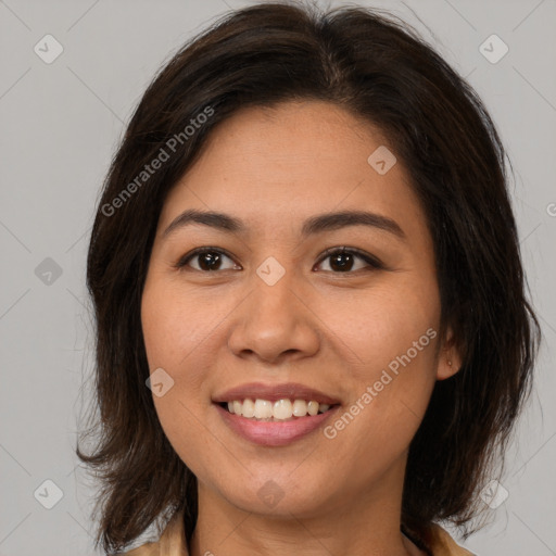 Joyful latino young-adult female with medium  brown hair and brown eyes