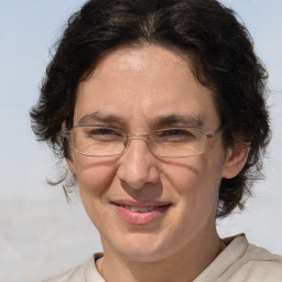 Joyful white middle-aged female with medium  brown hair and brown eyes