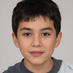 Joyful white child male with short  brown hair and brown eyes