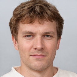 Neutral white adult male with short  brown hair and grey eyes