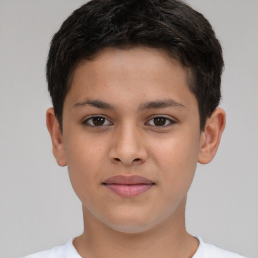 Joyful white child male with short  brown hair and brown eyes