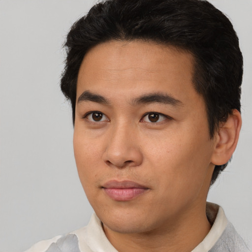 Neutral latino young-adult male with short  brown hair and brown eyes